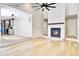Open floor plan shows living room with fireplace connecting to the kitchen with modern cabinetry at 1052 Yorktown Dr, Charleston, SC 29412