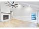 Bright living room with vaulted ceiling, fireplace, hardwood floors, and natural light at 1052 Yorktown Dr, Charleston, SC 29412