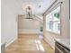 Living room featuring hardwood floors, large window, and contemporary light fixture at 1052 Yorktown Dr, Charleston, SC 29412