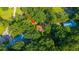 Aerial shot displays wooded privacy with the home nestled in a tree-filled landscape at 107 Joes Ln, Summerville, SC 29486