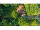 Aerial view of the house surrounded by trees showing the roof and yard at 107 Joes Ln, Summerville, SC 29486