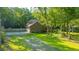 Aerial view of a brick house with a long driveway at 107 Joes Ln, Summerville, SC 29486