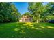 Spacious backyard with a view of the home's exterior at 107 Joes Ln, Summerville, SC 29486