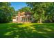 Expansive backyard featuring lush green lawn and mature trees at 107 Joes Ln, Summerville, SC 29486