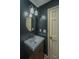 Stylish bathroom with oval mirror, modern lighting, and sleek vanity at 107 Joes Ln, Summerville, SC 29486