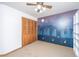 Carpeted bedroom with a mural and closet doors at 107 Joes Ln, Summerville, SC 29486