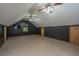 Finished bonus room with sloped ceiling, ceiling fans, and carpet at 107 Joes Ln, Summerville, SC 29486