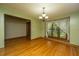 Dining room featuring wood floors, window, and stylish chandelier at 107 Joes Ln, Summerville, SC 29486