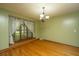 Dining room featuring wood floors, window, and stylish chandelier at 107 Joes Ln, Summerville, SC 29486