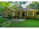 Charming brick and siding home featuring a well-manicured lawn and mature trees at 107 Joes Ln, Summerville, SC 29486