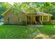 Attractive home with brick accents, siding, front lawn, and mature trees at 107 Joes Ln, Summerville, SC 29486