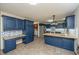 Stylish kitchen featuring blue cabinets, butcher block counters, and tile flooring at 107 Joes Ln, Summerville, SC 29486