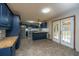 Spacious kitchen with blue cabinets, stainless appliances, tile floor, and a breakfast bar at 107 Joes Ln, Summerville, SC 29486