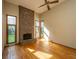 Bright living room featuring hardwood floors, a brick fireplace, and large windows at 107 Joes Ln, Summerville, SC 29486