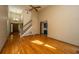 Spacious living room featuring wood floors, a staircase, and natural light at 107 Joes Ln, Summerville, SC 29486