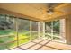 Relaxing screened porch with ceiling fan overlooking backyard at 107 Joes Ln, Summerville, SC 29486