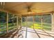Inviting screened porch with a ceiling fan and wood flooring, perfect for relaxation at 107 Joes Ln, Summerville, SC 29486