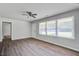 Spacious living room with hardwood floors, large windows, and neutral paint at 1112 Yeamans Hall Rd, Hanahan, SC 29410
