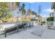 Back deck with outdoor seating and a patterned rug, overlooking a treed back yard at 112 Riviera Dr, Summerville, SC 29483