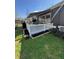Deck features a retractable awning, and stairs to a landscaped yard, perfect for outdoor entertaining at 112 Riviera Dr, Summerville, SC 29483