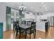 Bright dining room with hardwood floors, a chandelier, and views into the kitchen at 112 Riviera Dr, Summerville, SC 29483