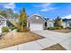 Inviting one-story home with gray siding, attached garage, and well-maintained landscaping at 112 Riviera Dr, Summerville, SC 29483
