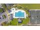 Aerial view of a sparkling blue swimming pool and tennis courts at 112 Riviera Dr, Summerville, SC 29483