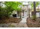 Backyard featuring a screened porch and lush greenery, offering a private outdoor space at 114 Grand Palm Ln, Summerville, SC 29485
