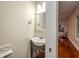 Cozy bathroom with a rustic vanity and a decorative mirror at 114 Grand Palm Ln, Summerville, SC 29485