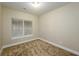Cozy bedroom with neutral walls and carpet flooring, featuring a window with blinds at 114 Grand Palm Ln, Summerville, SC 29485
