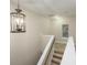 Hallway with carpeted stairs and a stylish light fixture at 114 Grand Palm Ln, Summerville, SC 29485