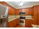 Kitchen with stainless steel appliances, granite counters, and wood cabinets at 114 Grand Palm Ln, Summerville, SC 29485