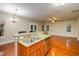 Open-concept kitchen with granite countertops, stainless steel sink, and a view into the living area at 114 Grand Palm Ln, Summerville, SC 29485