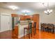 Open kitchen features granite countertops, stainless appliances, and an island with seating at 114 Grand Palm Ln, Summerville, SC 29485