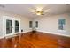 Spacious living room with gleaming hardwood floors and ample natural light at 114 Grand Palm Ln, Summerville, SC 29485