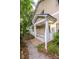 Inviting covered porch features classic white columns and lattice details at 114 Grand Palm Ln, Summerville, SC 29485