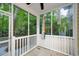 Cozy screened porch with views of the serene, wooded backyard, perfect for relaxing outdoors at 114 Grand Palm Ln, Summerville, SC 29485