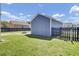 Backyard featuring a shed, fire pit, and well-maintained lawn at 117 Red Leaf Blvd, Moncks Corner, SC 29461