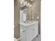 Bright bathroom featuring a white vanity, framed mirror, toilet, and chrome fixtures at 117 Red Leaf Blvd, Moncks Corner, SC 29461