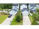 Aerial view of a new neighborhood with well-manicured lawns, driveways, and attached garages at 120 E Respite Ln, Summerville, SC 29483