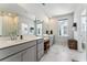 Spacious bathroom with dual vanities, marble floors, and a separate glass shower at 120 E Respite Ln, Summerville, SC 29483