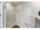 Modern bathroom with a glass-enclosed shower, white subway tile, and marble floors at 120 E Respite Ln, Summerville, SC 29483