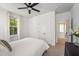 Bright bedroom features a ceiling fan, neutral walls, and a window offering natural light at 120 E Respite Ln, Summerville, SC 29483