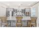 Bright, spacious kitchen with large quartz island, stainless appliances, and modern light-gray cabinets at 120 E Respite Ln, Summerville, SC 29483