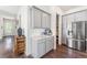 Butler's pantry boasts stainless steel refrigerator, modern cabinetry, and convenient access to the main kitchen at 120 E Respite Ln, Summerville, SC 29483