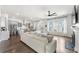 Open-concept living room showcases hardwood floors, fireplace and a view to the modern kitchen at 120 E Respite Ln, Summerville, SC 29483