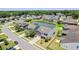 An aerial view of a neighborhood, featuring a pond, well-manicured lawns and houses at 1302 Paint Horse Ct, Mount Pleasant, SC 29429