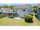 Spacious backyard with a screened porch, patio, and privacy landscaping at 1302 Paint Horse Ct, Mount Pleasant, SC 29429