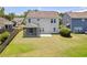 Expansive backyard features a screened porch, patio, and mature landscaping at 1302 Paint Horse Ct, Mount Pleasant, SC 29429
