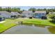 Large backyards with screened porches overlook a serene pond, enhancing the neighborhood's appeal at 1302 Paint Horse Ct, Mount Pleasant, SC 29429